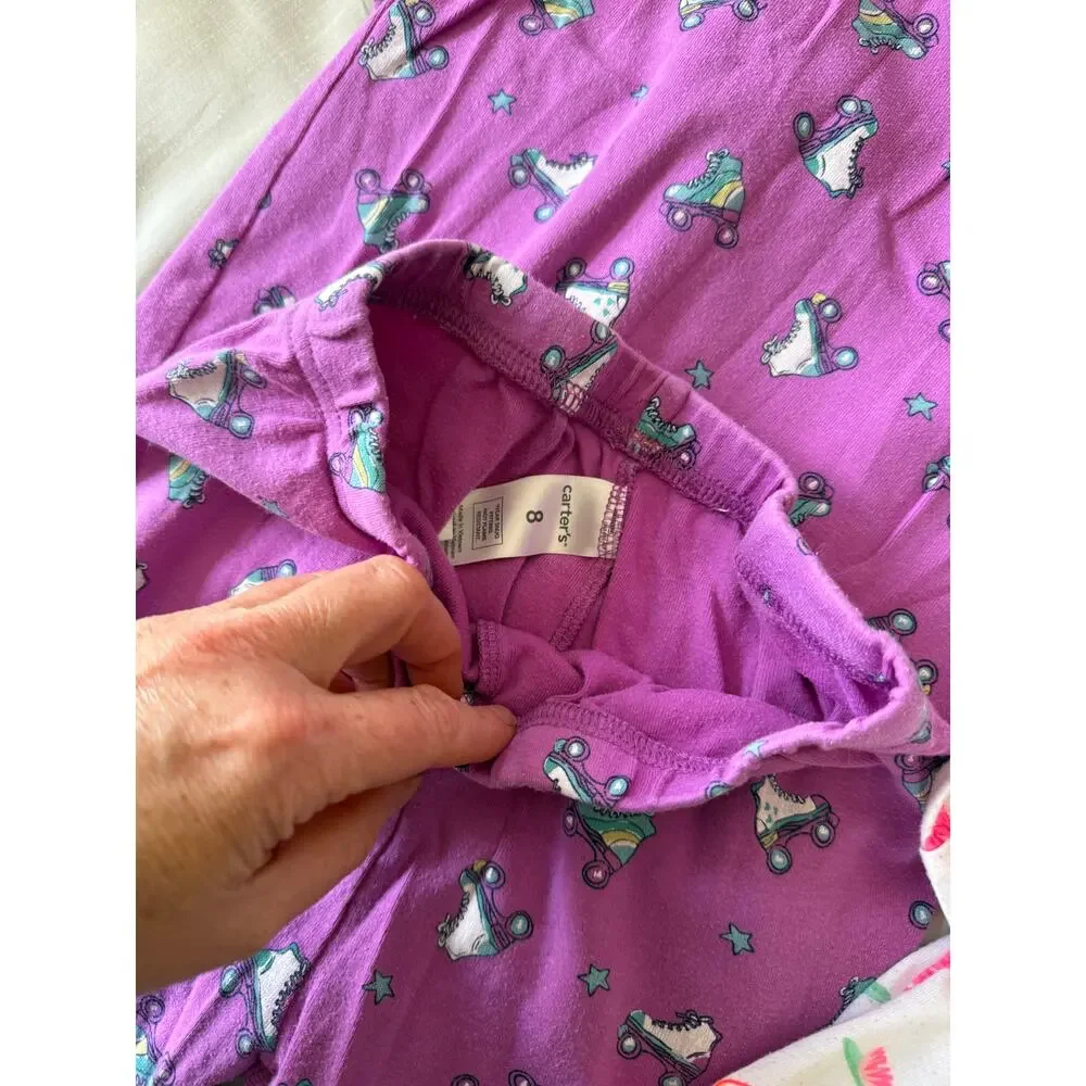Carters purple rollar skate and white flamingo pajamas size 7 an 8